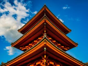 orange tower under white and blue sky